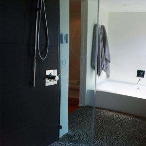 modern bath remodel pebble stone floor                                         